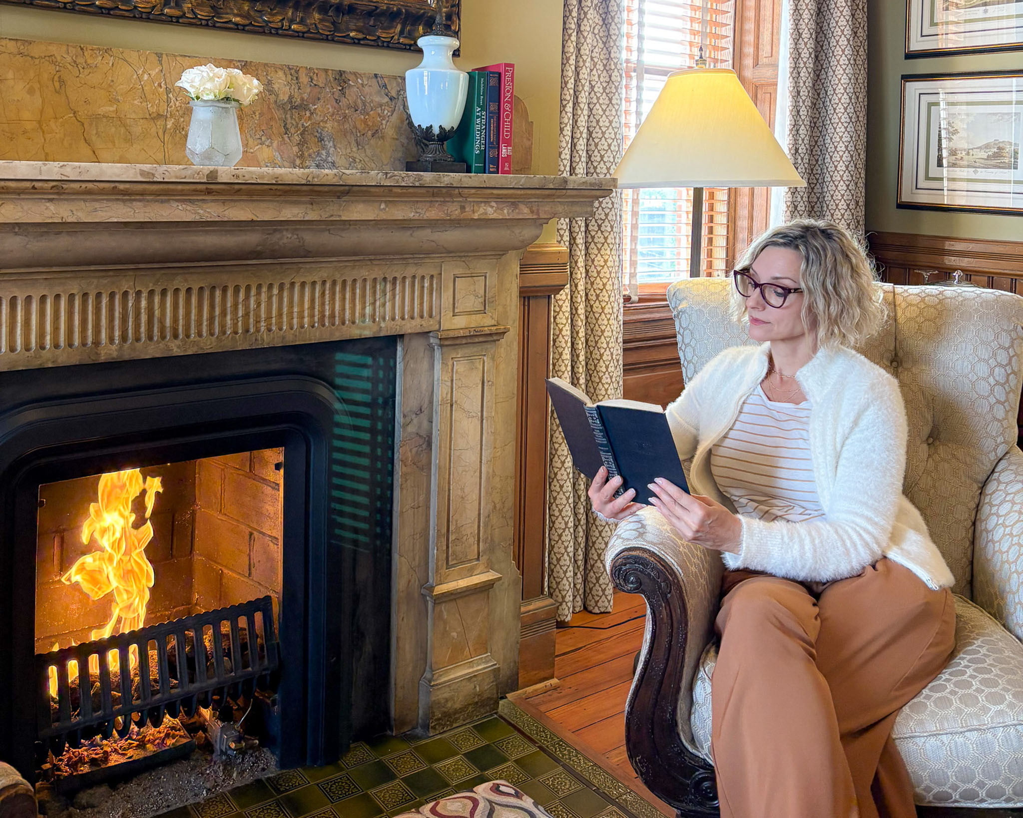 Reading by fire at Wentworth Mansion