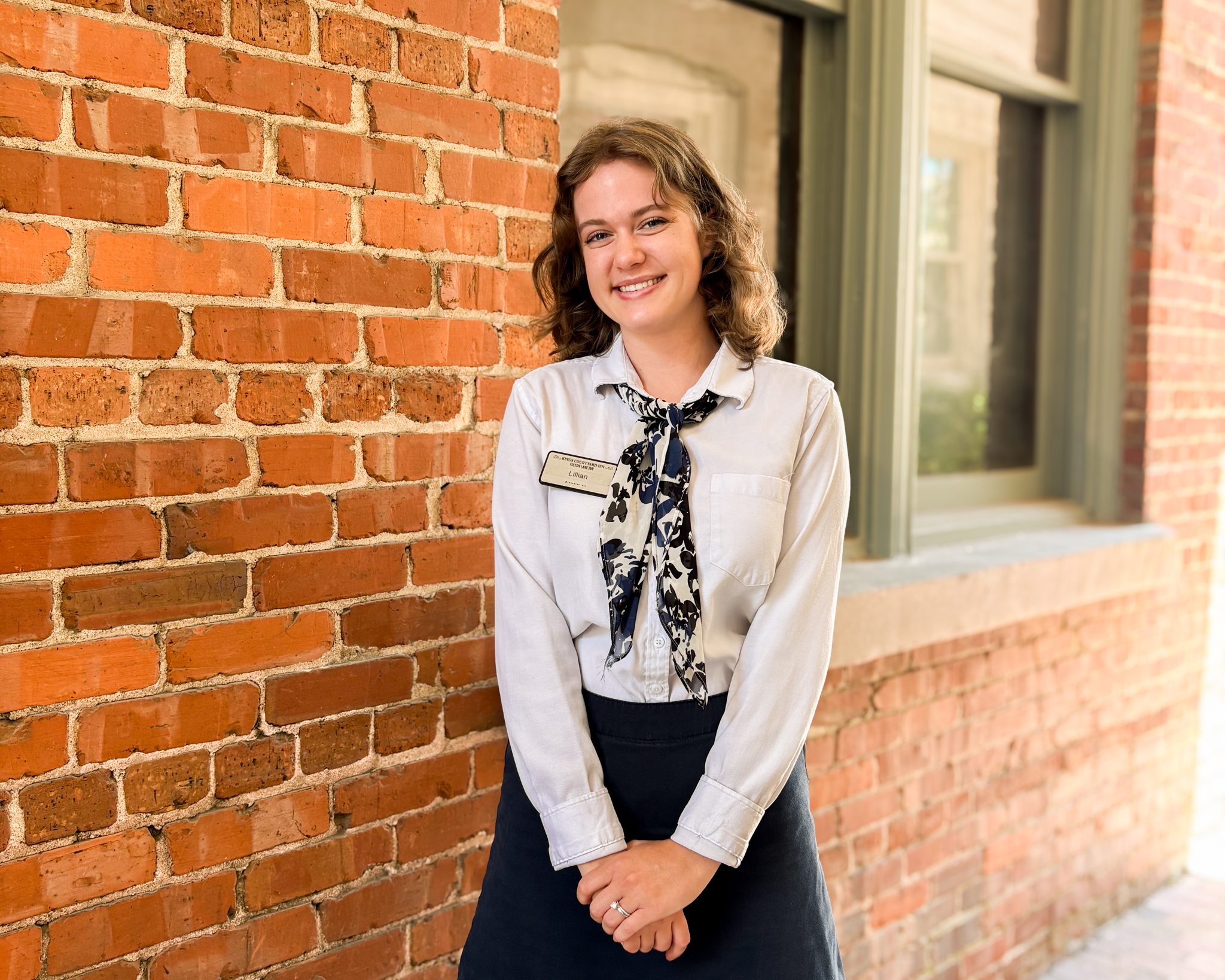 concierge lillian standing outside of fulton lane inn